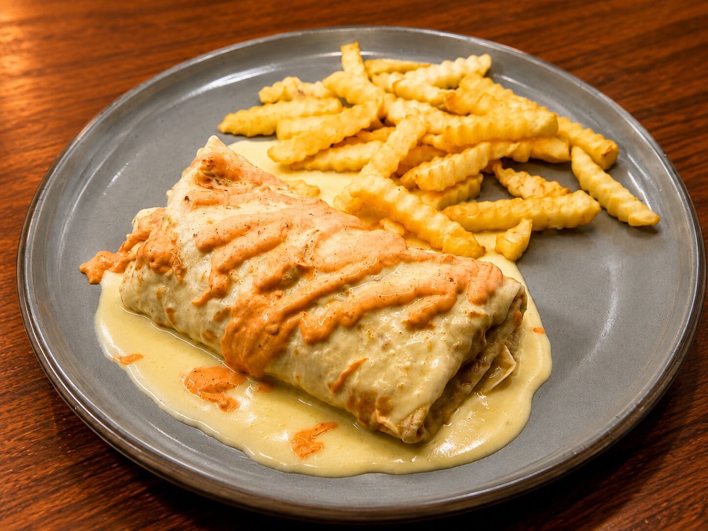 A hearty Philly steak burrito served at Los Bandidos